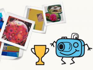 Knipsi kennt sich mit Fotos aus Fotoapparat Knipsi und ein goldener Pokal vor Fotografien